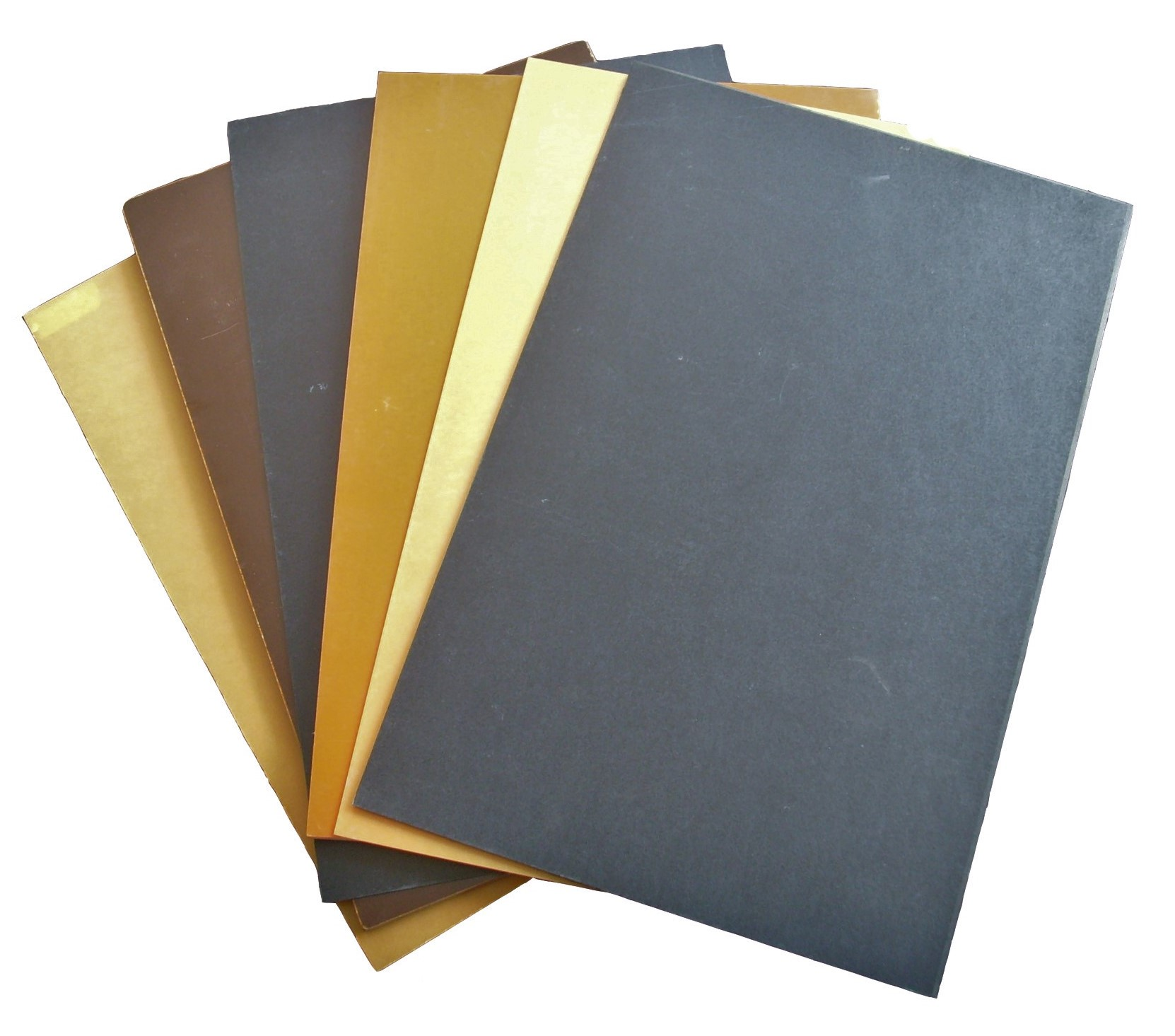 Phenolic paper and cotton cloth laminate sheets displayed in various colors and thicknesses for industrial insulation