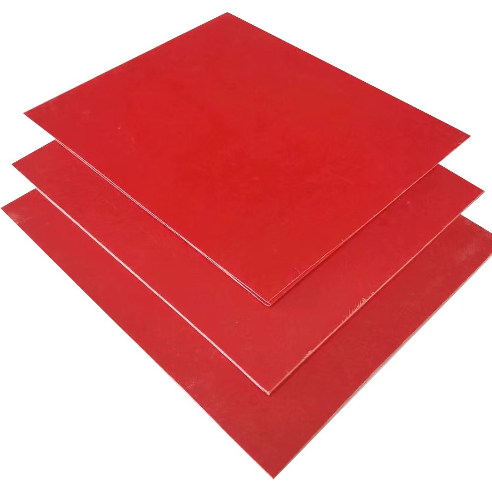 Stacked red GPO3 UPGM203 insulation sheets for electrical applications.
